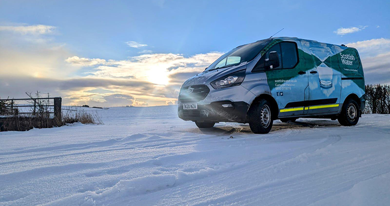 Scottish Water van on snowy road in winter