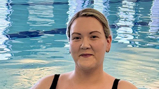 Head and shoulders of Learn to Swim student Laura McLeod in a swimming pool