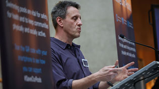 Man standing at Podium