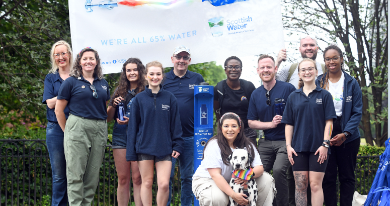 Group of Scottish Water employees gather at Top Up Tap