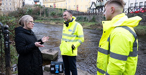 Cabinet Secretary Gillian Martin, Professor Simon Parsons and Scottish Water operative Ethan Hermiston at Water of Leith in Stockbridge, Edinburgh