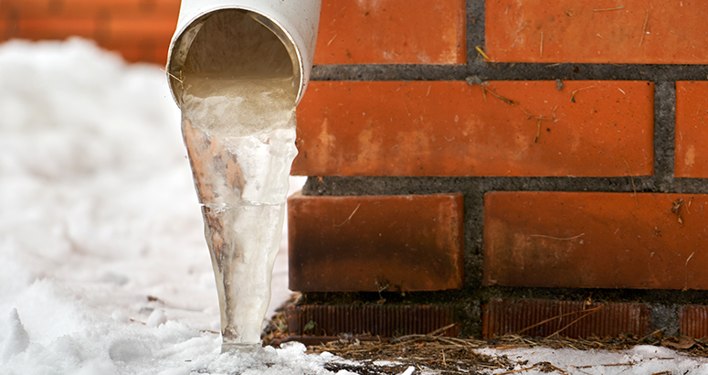 Downpipe with ice inside in winter